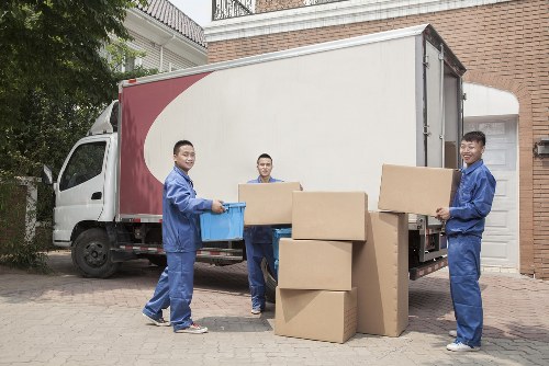 Specialist movers securing a piano inside a transport vehicle