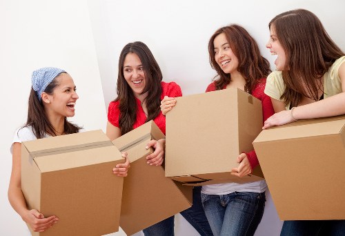 Moving boxes and furniture prepared for a house removal service