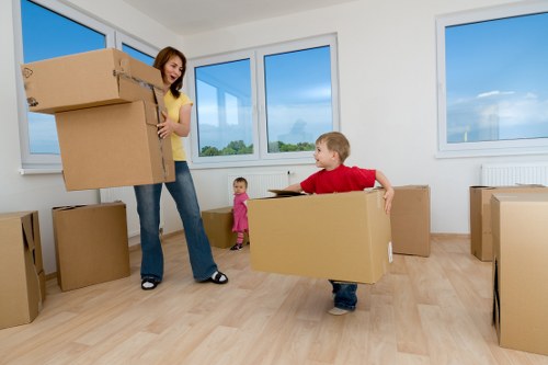 Worker using protective gloves while handling furniture