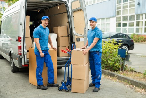 Heavy item being lifted carefully during a move